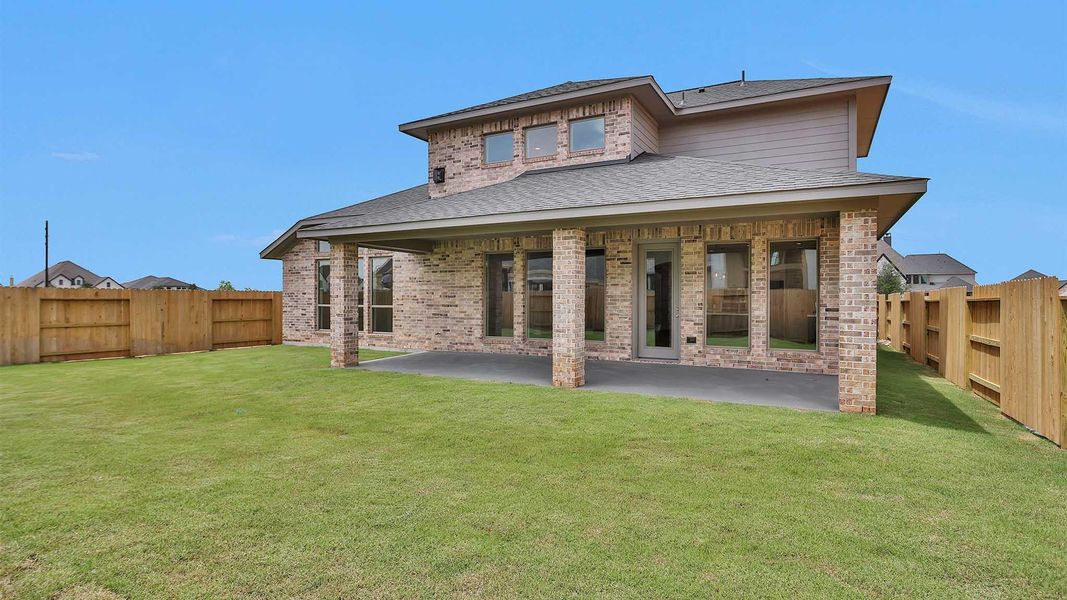 Front exterior of a new home in Grange 60', Katy, TX, highlighting curb appeal (Image 2).