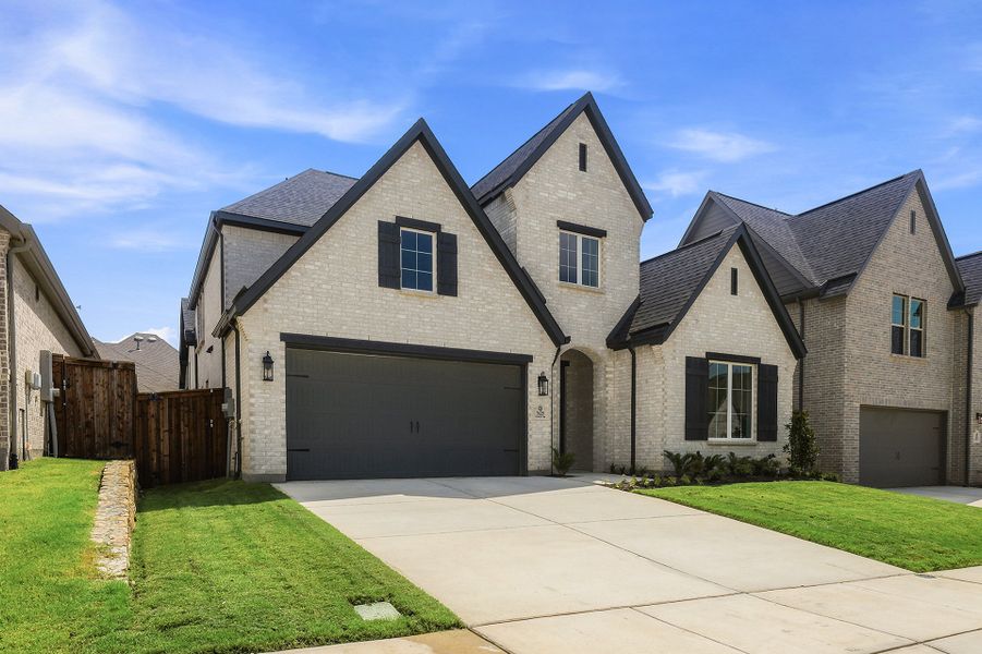 Front exterior of a new home in Tavolo Park, Fort Worth, TX, highlighting curb appeal (Image 26).