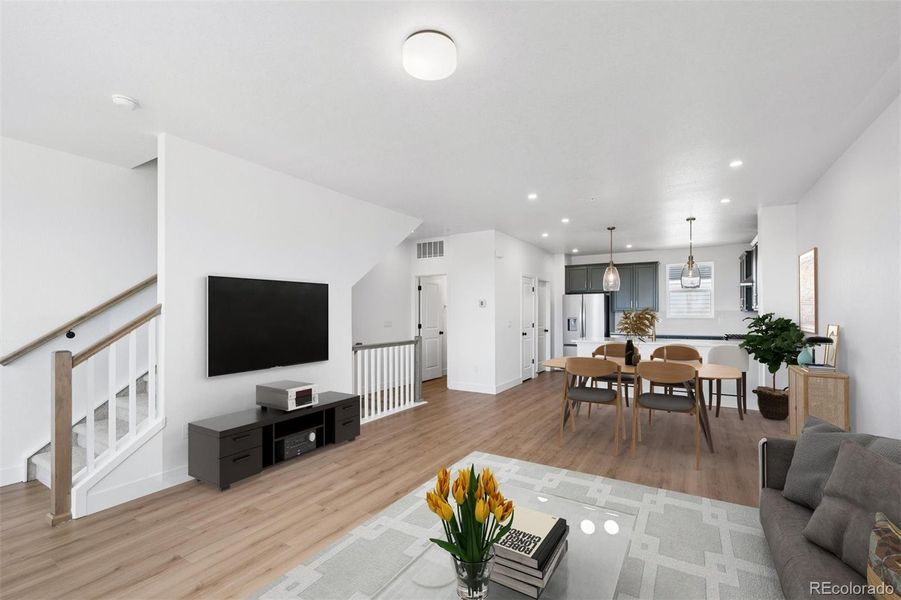 Light filled open concept main level. Virtually staged.