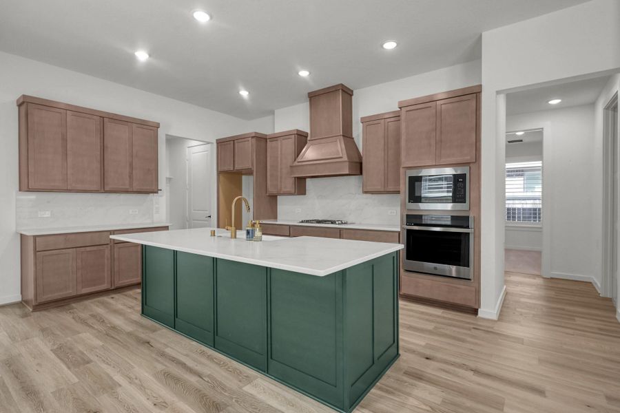 The countertops are OmegaStone and the backsplash is seamless giving this a high end look.