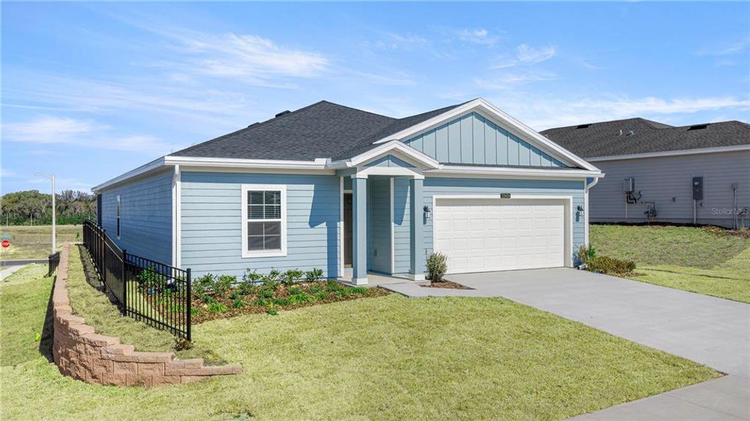 Front exterior of a new home in Trailhead Landing, Alachua, FL, highlighting curb appeal (Image 3). Front exterior of a new home in Trailhead Landing, Alachua, FL, highlighting curb appeal (Image 3).