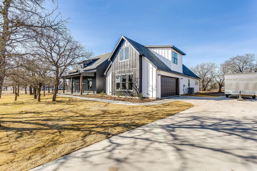 Representative exterior photo of a completed home built from the Erin by Trinity Classic Homes in The Reserve at Shadle, Poolville, TX (Image 25). Representative exterior photo of a completed home built from the Erin by Trinity Classic Homes in The Reserve at Shadle, Poolville, TX (Image 25).