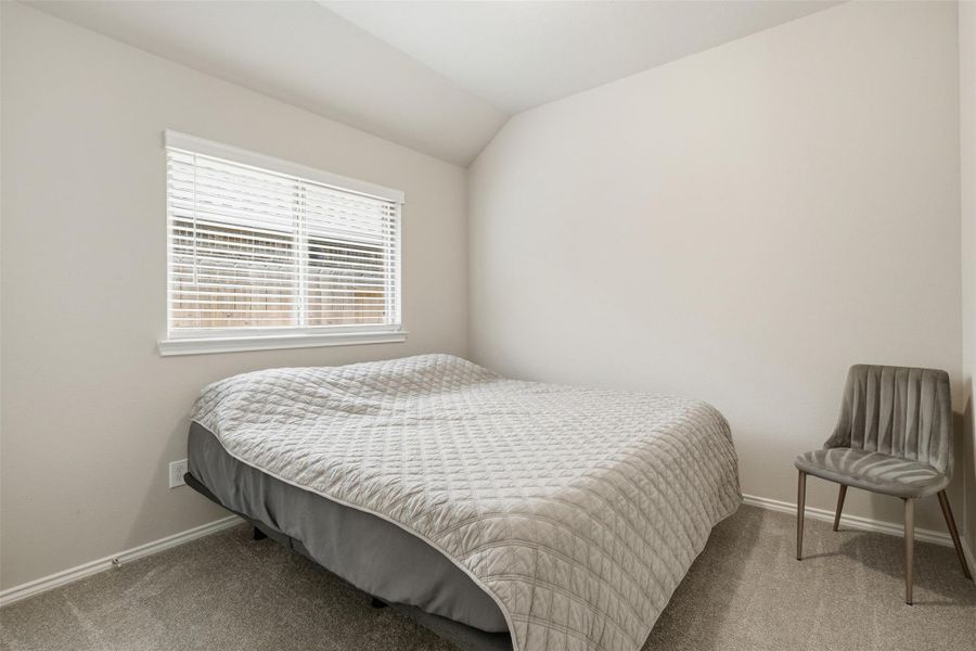 This cozy bedroom features soft neutral tones, a window with blinds for natural light, and a spacious closet. This cozy bedroom features soft neutral tones, a window with blinds for natural light, and a spacious closet.