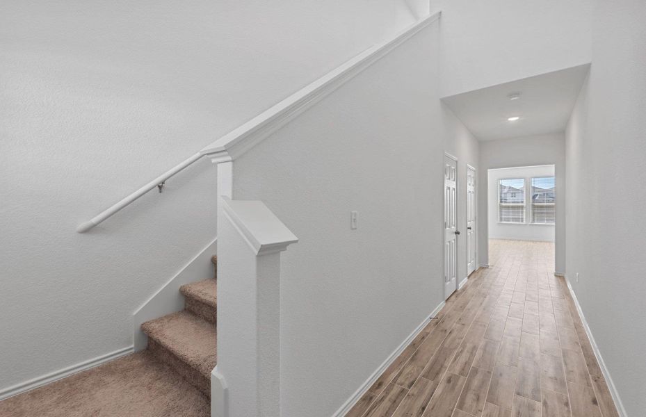 Stairs with wood finished floors and baseboards Stairs with wood finished floors and baseboards