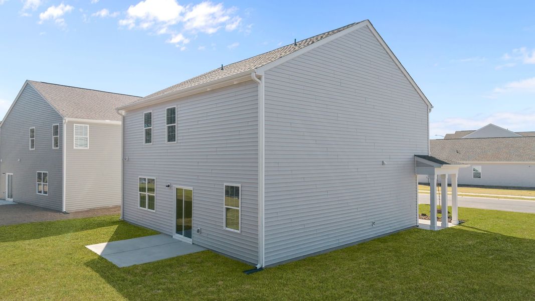 Exterior details and patio area of a home in Ridgewood Farms, Winterville (Image 11).