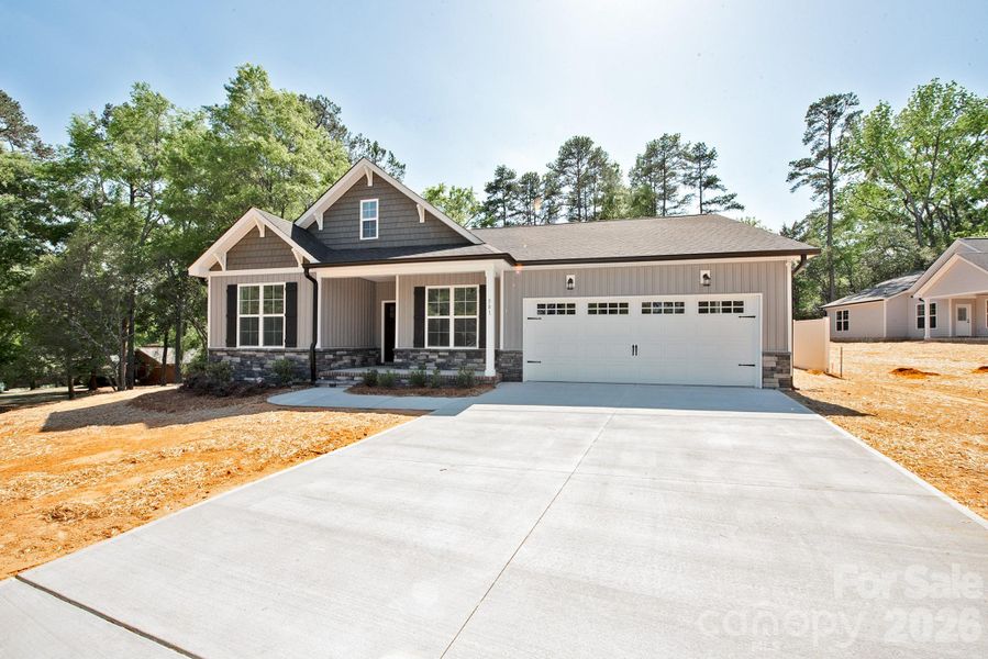 Front exterior of a new home in , Concord, NC, highlighting curb appeal (Image 20).
