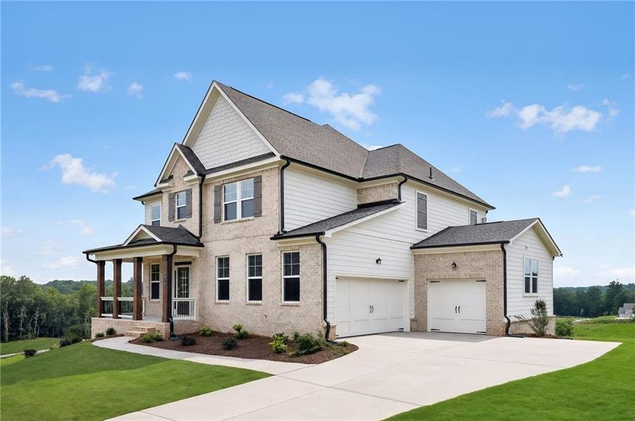 Front exterior of a new home in Estates at Yellow Creek, Cumming, GA, highlighting curb appeal (Image 2). Front exterior of a new home in Estates at Yellow Creek, Cumming, GA, highlighting curb appeal (Image 2).