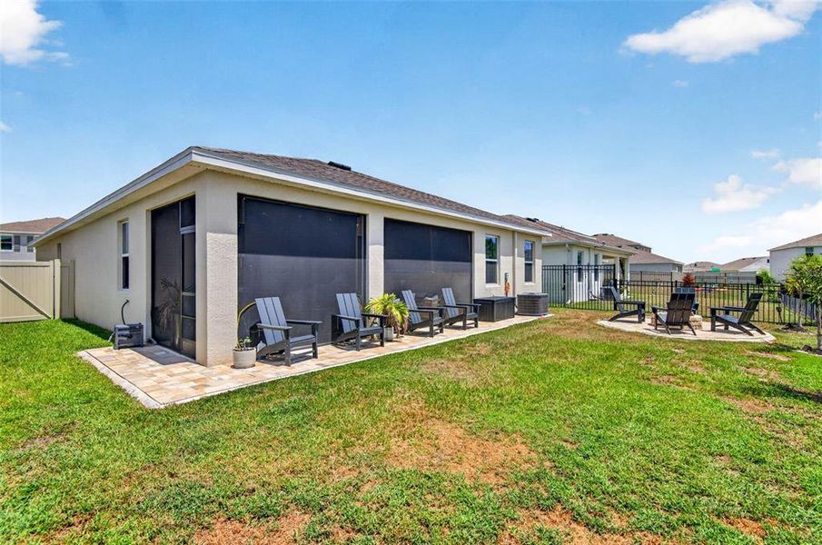 Exterior details and patio area of a home in Bella Lago, Parrish (Image 26).
