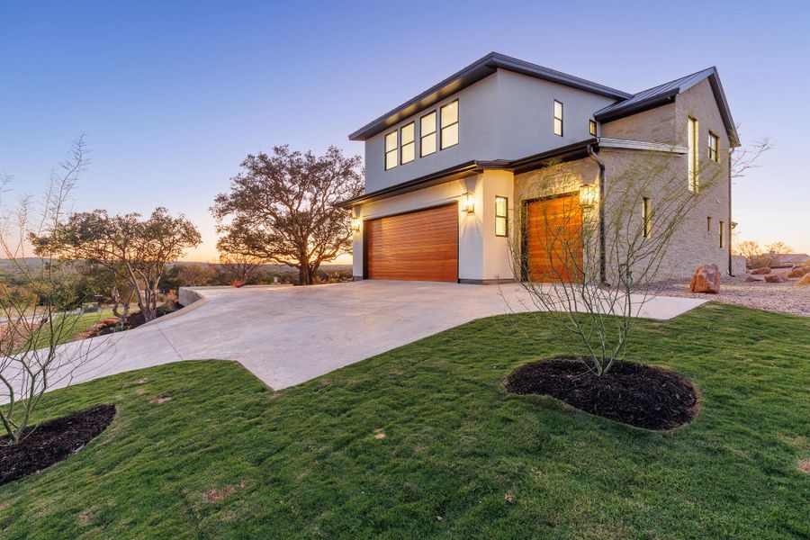 Front exterior of a new home in , Horseshoe Bay, TX, highlighting curb appeal (Image 1). Front exterior of a new home in , Horseshoe Bay, TX, highlighting curb appeal (Image 1).