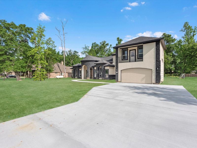Front exterior of a new home in , Dayton, TX, highlighting curb appeal (Image 22).