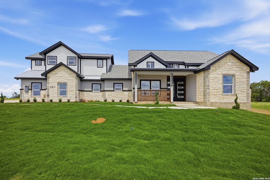 Front exterior of a new home in , Floresville, TX, highlighting curb appeal (Image 19).