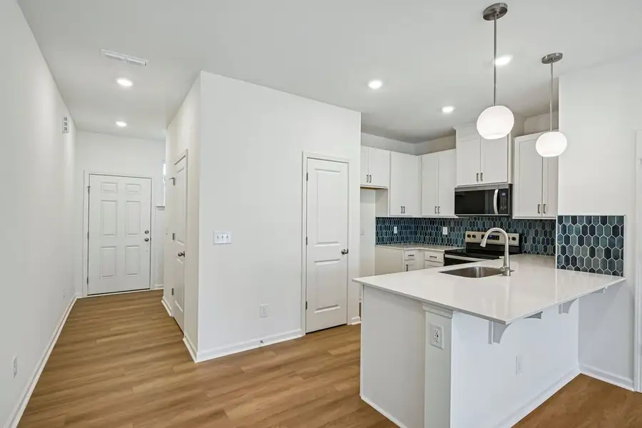Furnished interior view inside a new home in Brooks Mill - Edge Series, Durham (Image 4).