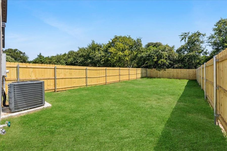 View of fenced backyard