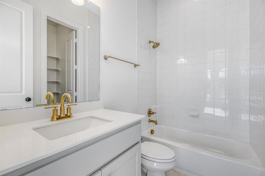 Bathroom featuring bathtub / shower combination and vanity