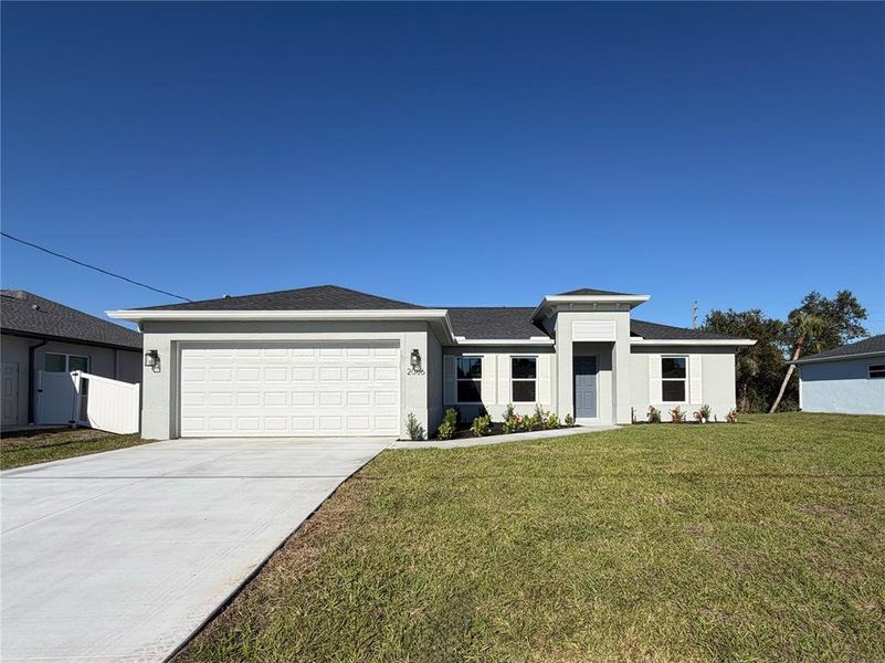 Front exterior of a new home in , North Port, FL, highlighting curb appeal (Image 1). Front exterior of a new home in , North Port, FL, highlighting curb appeal (Image 1).