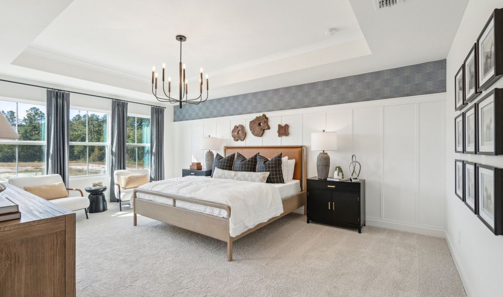 Primary suite with decorative feature wall Primary suite with decorative feature wall