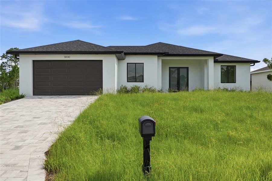 Front exterior of a new home in , Port Charlotte, FL, highlighting curb appeal (Image 19). Front exterior of a new home in , Port Charlotte, FL, highlighting curb appeal (Image 19).