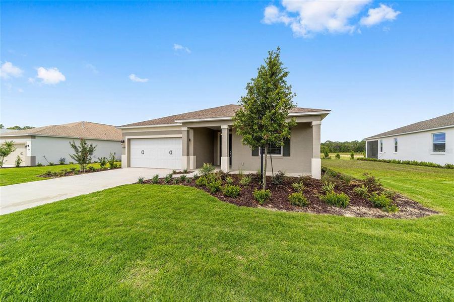 Front exterior of a new home in , Ocala, FL, highlighting curb appeal (Image 2). Front exterior of a new home in , Ocala, FL, highlighting curb appeal (Image 2).