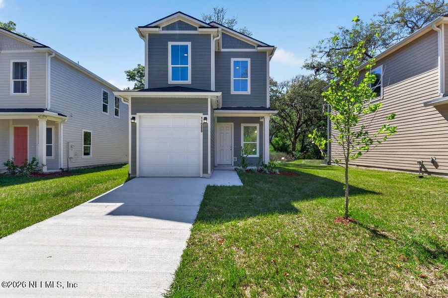 Front exterior of a new home in , Jacksonville, FL, highlighting curb appeal (Image 33).