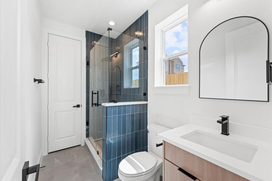 Sleek, modern secondary bathroom with luxe, hotel-quality detailing Sleek, modern secondary bathroom with luxe, hotel-quality detailing