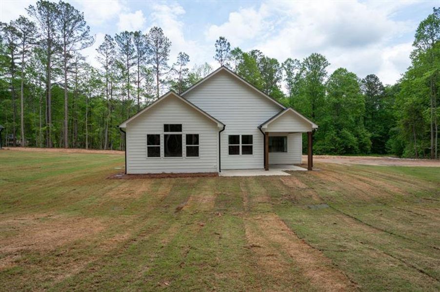Front exterior of a new home in , Dallas, GA, highlighting curb appeal (Image 1).