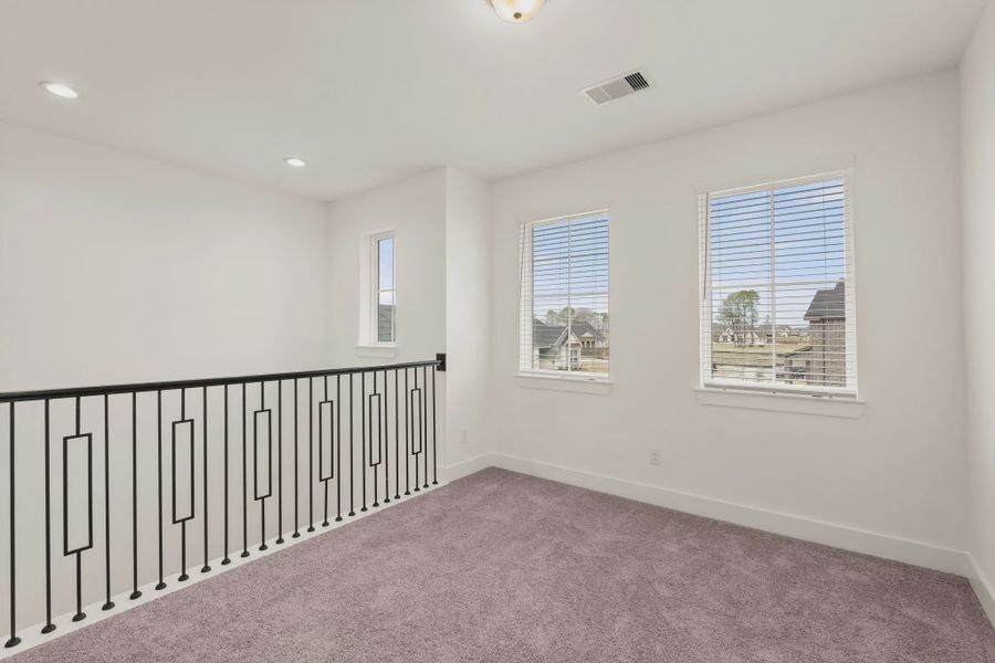 Representative unfurnished interior of a home built from the St Andrews by Chesmar Homes in Riceland Alley Loads, Mont Belvieu (Image 62).