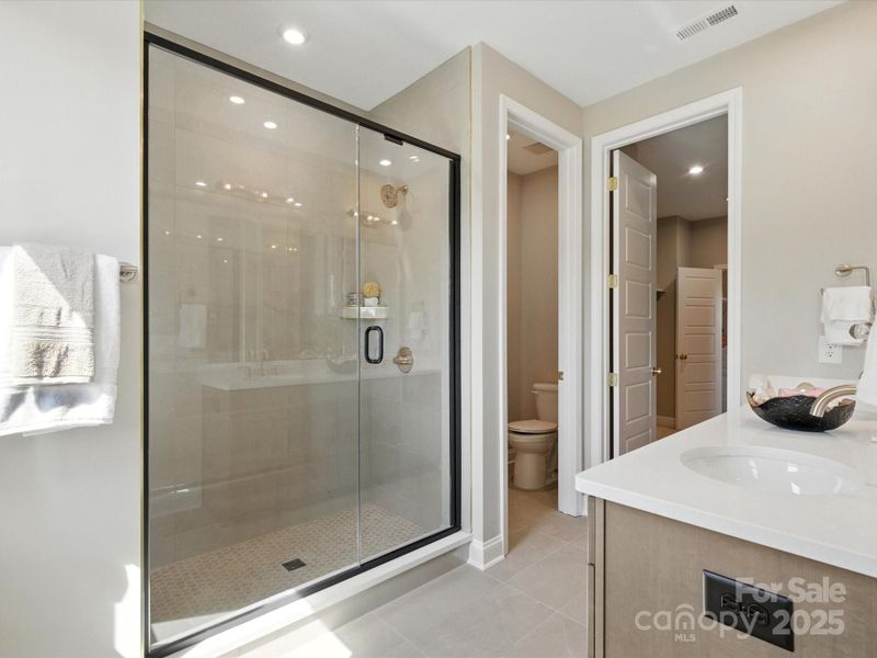 Large walk-in shower with modern oversized tiles. *Model Photos | Orientation and structural selections may vary. Large walk-in shower with modern oversized tiles. *Model Photos | Orientation and structural selections may vary.