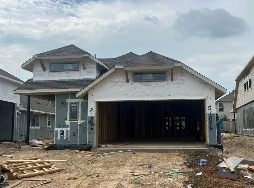 Front exterior of a new home in Bridgeland 40', Cypress, TX, highlighting curb appeal (Image 8). Front exterior of a new home in Bridgeland 40', Cypress, TX, highlighting curb appeal (Image 8).