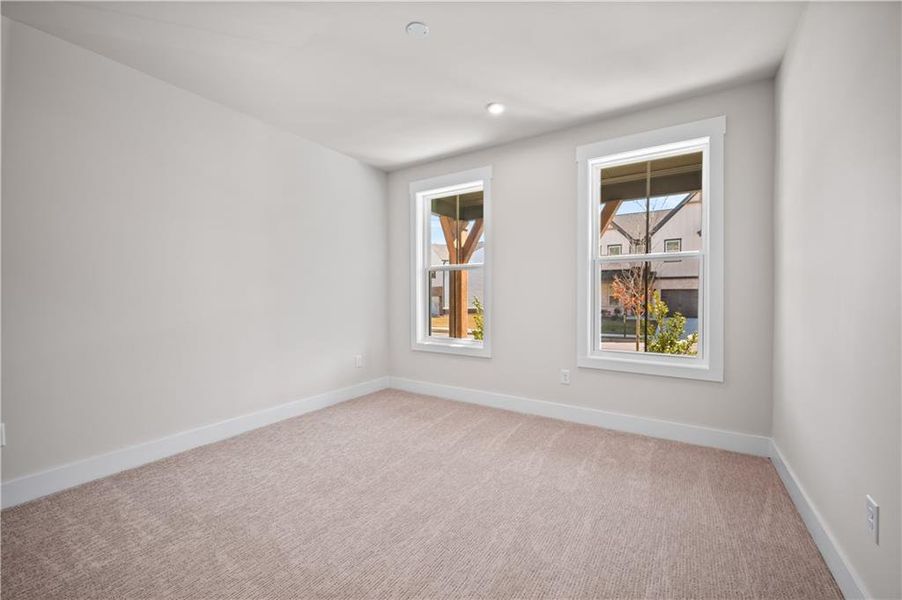 Spacious, unfurnished interior of a new home in The Paddocks at Doc Hughes, Buford (Image 26).