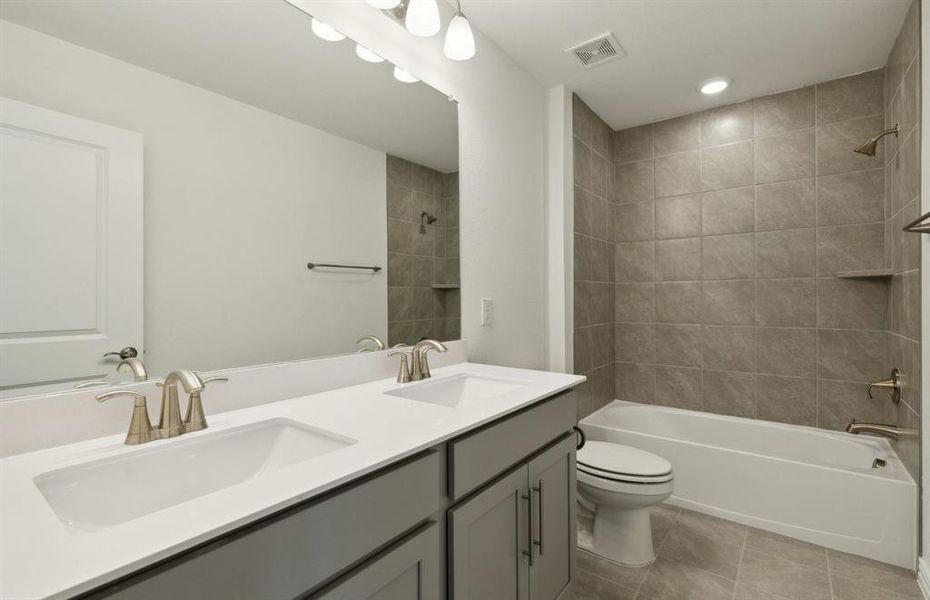 Spacious secondary bathroom with upgraded finishes *real home pictured