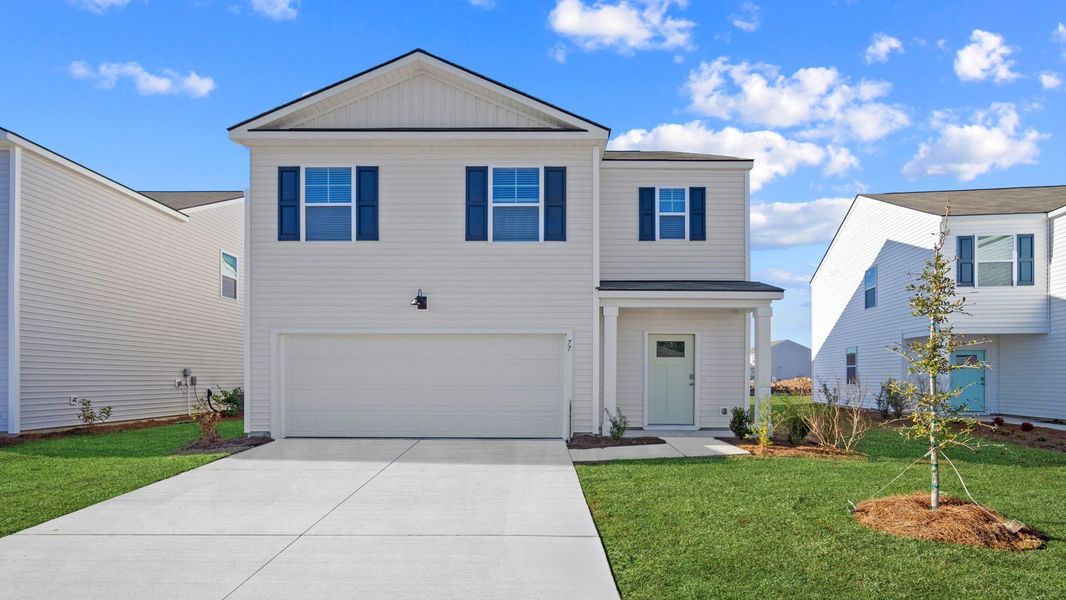 Front exterior of a new home in The Retreat at East Argent, Ridgeland, SC, highlighting curb appeal (Image 1). Front exterior of a new home in The Retreat at East Argent, Ridgeland, SC, highlighting curb appeal (Image 1).