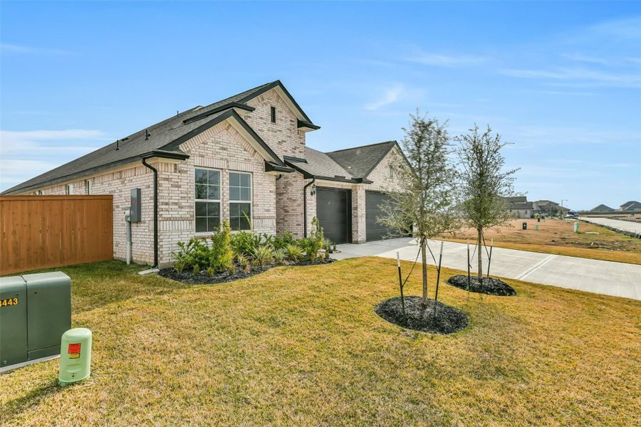 Front exterior of a new home in Lago Mar, Texas City, TX, highlighting curb appeal (Image 22).