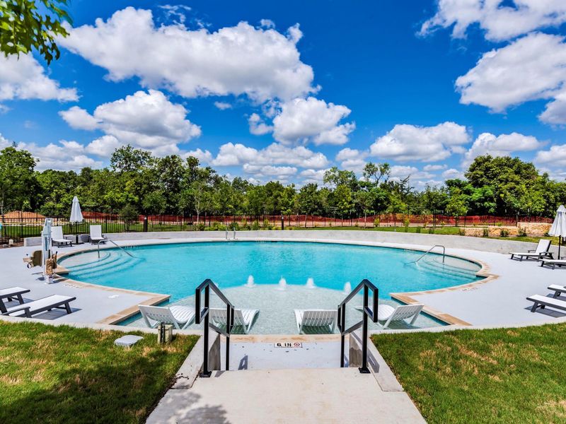 Community pool featuring a patio and view of the greenbelt area Community pool featuring a patio and view of the greenbelt area