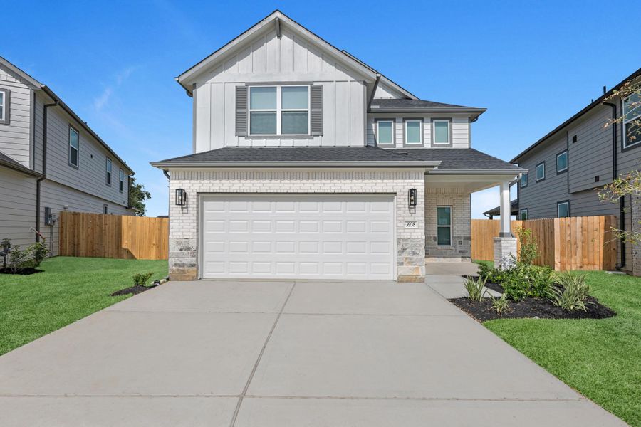 Front exterior of a new home in Grand Oaks Village, Houston, TX, highlighting curb appeal (Image 16). Front exterior of a new home in Grand Oaks Village, Houston, TX, highlighting curb appeal (Image 16).