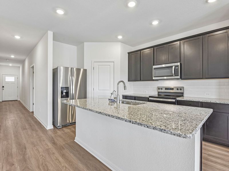 Furnished interior view inside a new home in Creekfall, Burnet (Image 4).