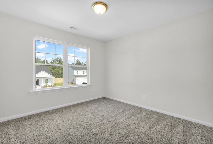 Representative unfurnished interior of a home built from the The Magnolia by Smith Family Homes in Sweetwater, Brunswick (Image 37).