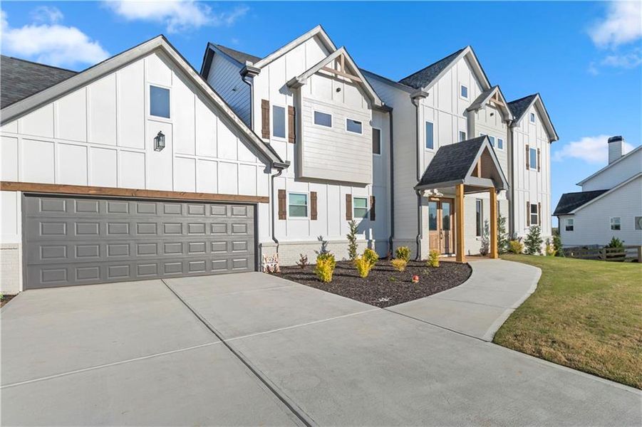 Front exterior of a new home in , Clermont, GA, highlighting curb appeal (Image 23). Front exterior of a new home in , Clermont, GA, highlighting curb appeal (Image 23).