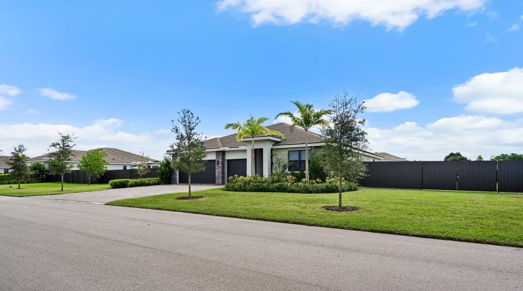 Front exterior of a new home in , Homestead, FL, highlighting curb appeal (Image 21). Front exterior of a new home in , Homestead, FL, highlighting curb appeal (Image 21).