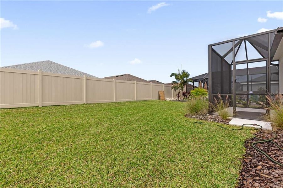 Exterior details and patio area of a home in Canoe Creek, Parrish (Image 21).