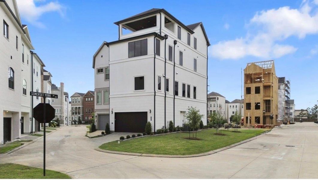 Discover this rare corner-lot home featuring modern design, a roomy two-car garage with extra driveway and street parking, and a rooftop terrace with stunning city views. Discover this rare corner-lot home featuring modern design, a roomy two-car garage with extra driveway and street parking, and a rooftop terrace with stunning city views.