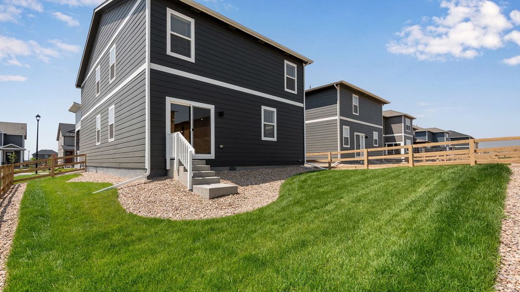 Exterior details and patio area of a home in Prairie Song, Windsor (Image 3).