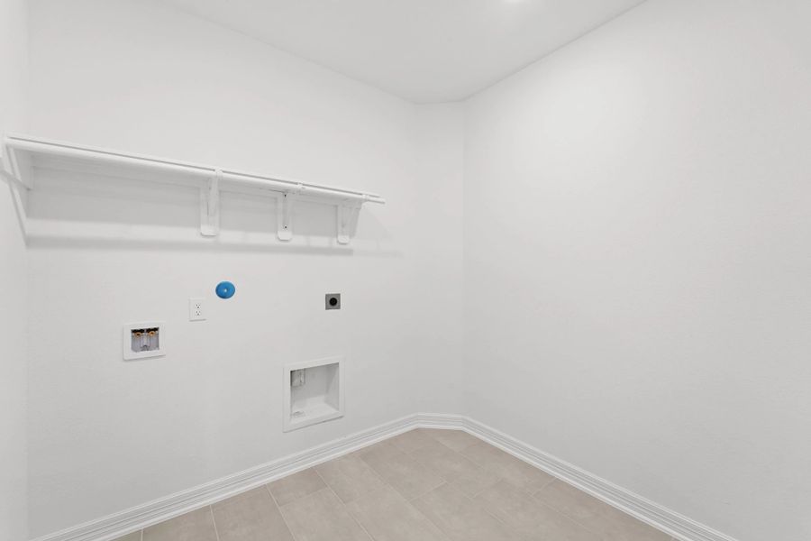Utility room. Note: Sample product photo. Actual exterior and interior selections may vary by homesite. Photo may be virtually staged