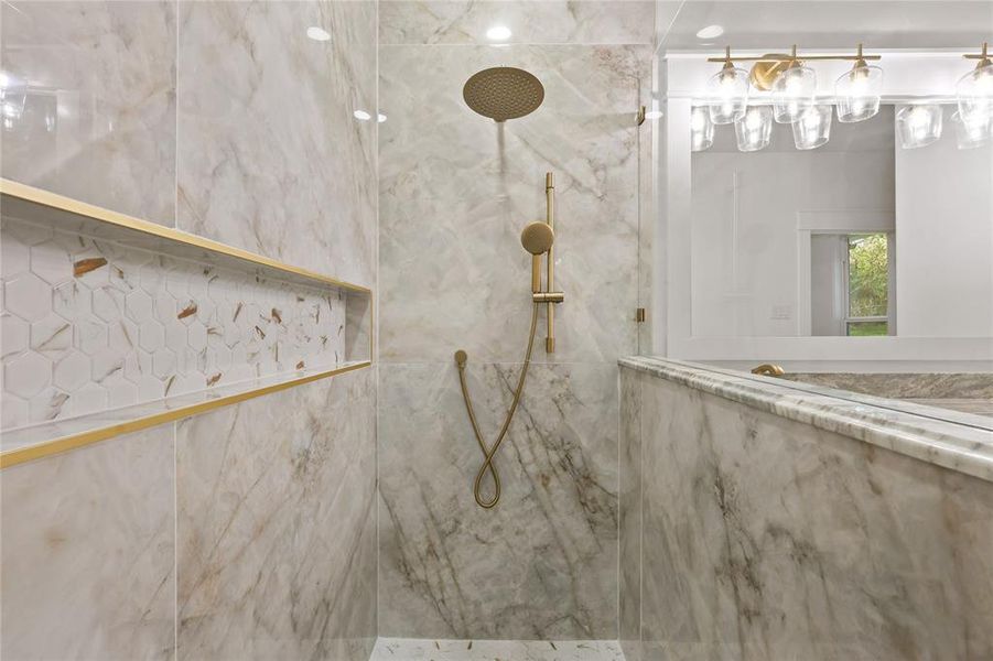 Bathroom with a marble finish shower