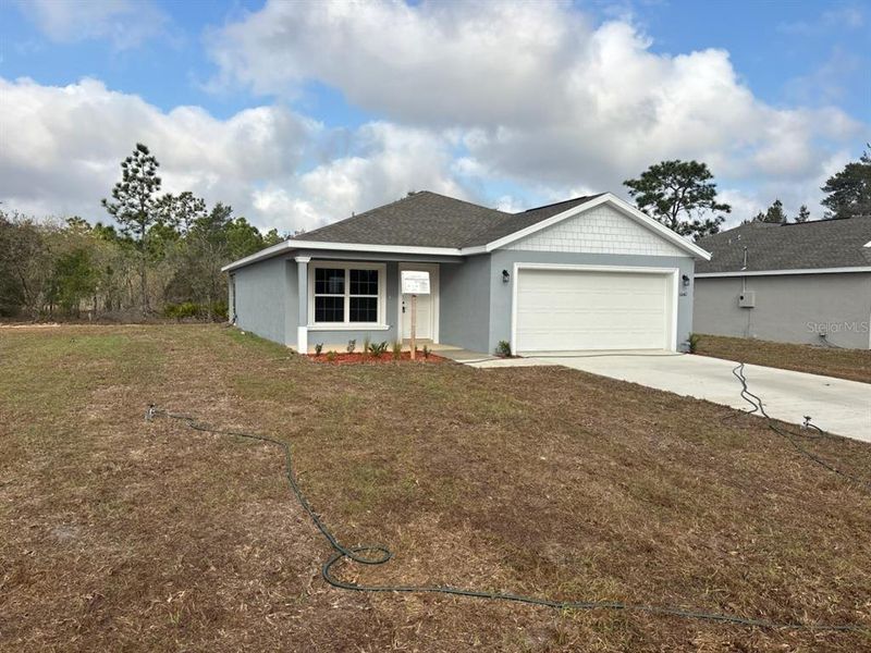Front exterior of a new home in , Dunnellon, FL, highlighting curb appeal (Image 1). Front exterior of a new home in , Dunnellon, FL, highlighting curb appeal (Image 1).