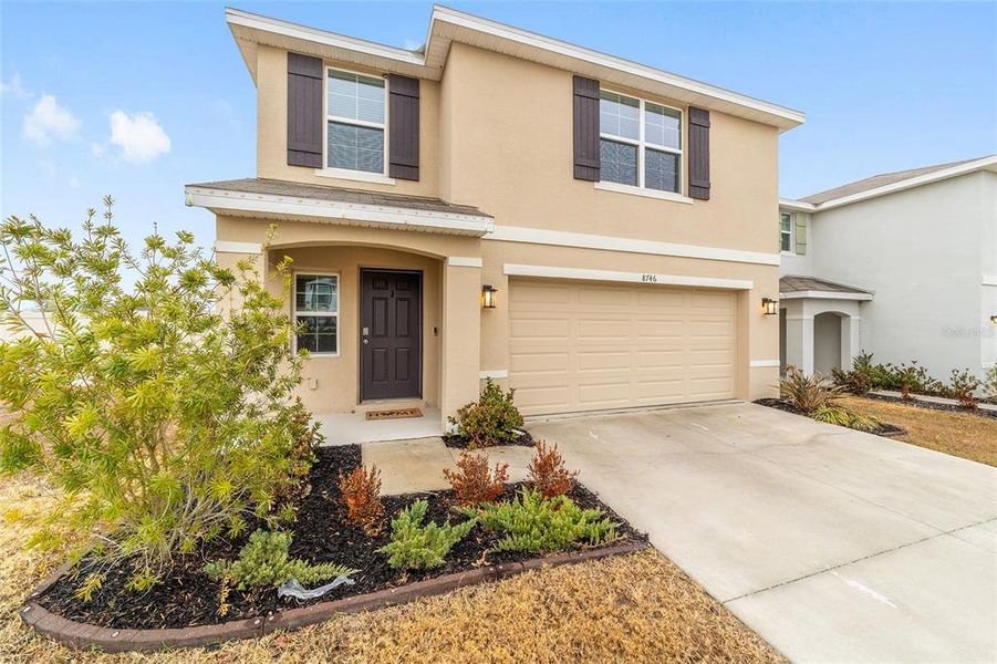 Front exterior of a new home in Ocala Crossings South, Ocala, FL, highlighting curb appeal (Image 23). Front exterior of a new home in Ocala Crossings South, Ocala, FL, highlighting curb appeal (Image 23).