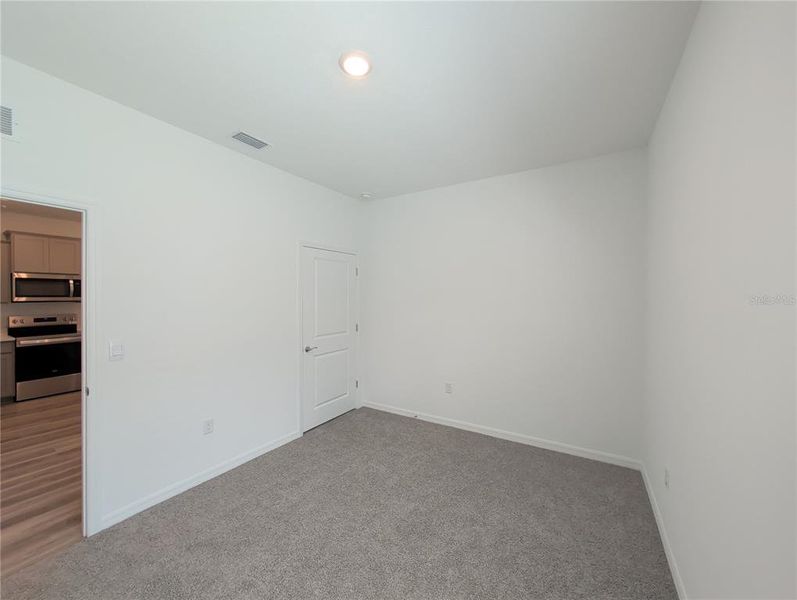 Spacious, unfurnished interior of a new home in Farm at Varrea Villas, Plant City (Image 17).