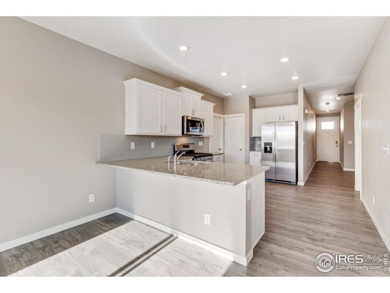 Furnished interior view inside a new home in Silver Peaks, Lochbuie (Image 5).