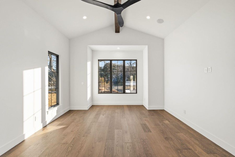 Spare room featuring dark wood finished floors, beamed ceiling, a ceiling fan, and recessed lighting