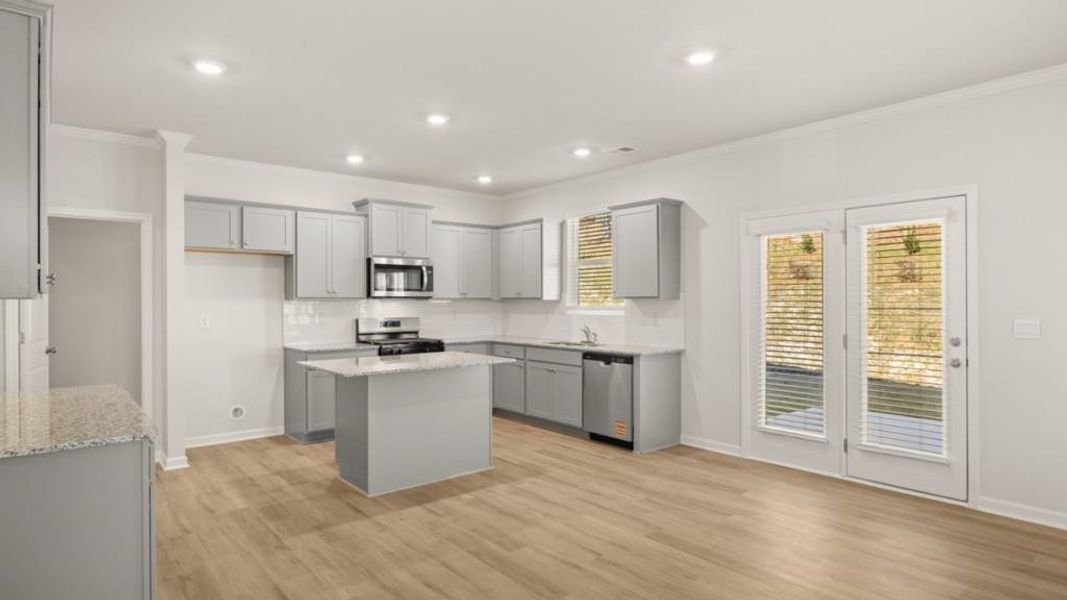 Furnished interior view inside a new home in Northwoods at Mirror Lake, Villa Rica (Image 10).