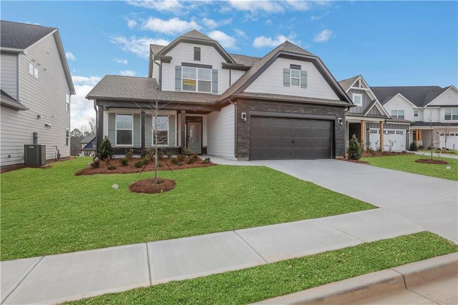 Front exterior of a new home in Twin Lakes, Hoschton, GA, highlighting curb appeal (Image 23).